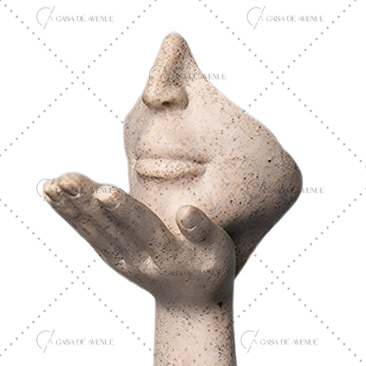 Face In Hand Sculptur