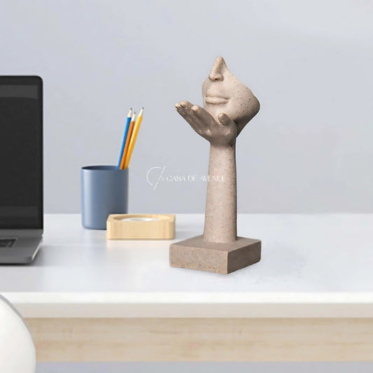 Face In Hand Sculptur